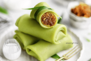 Vegan Pandan rolled crepes with grated coconut in gula melaka - Kuih Dadar